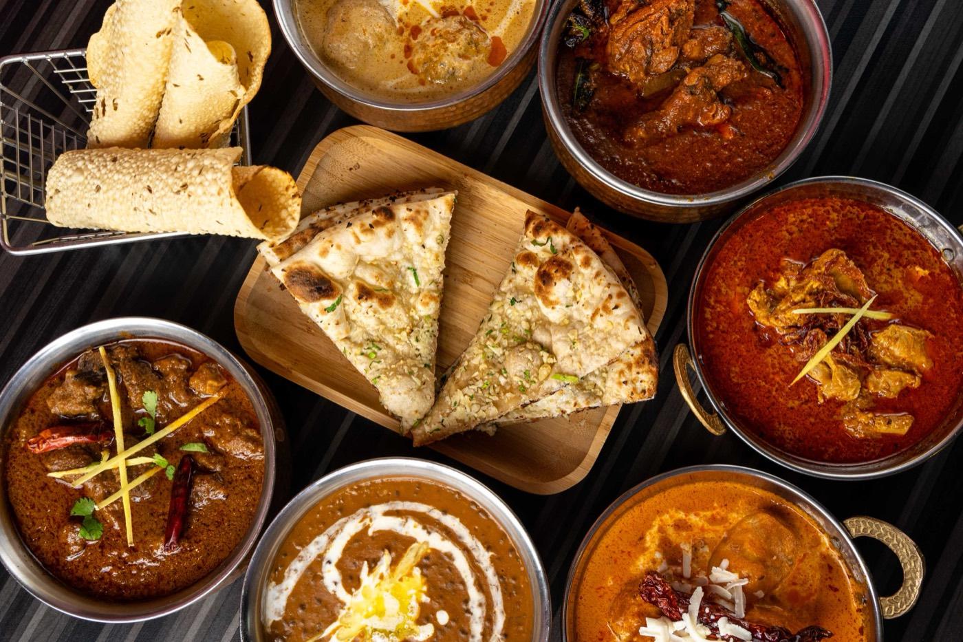 India 101 buffet spread of Halal Indian curries with naan