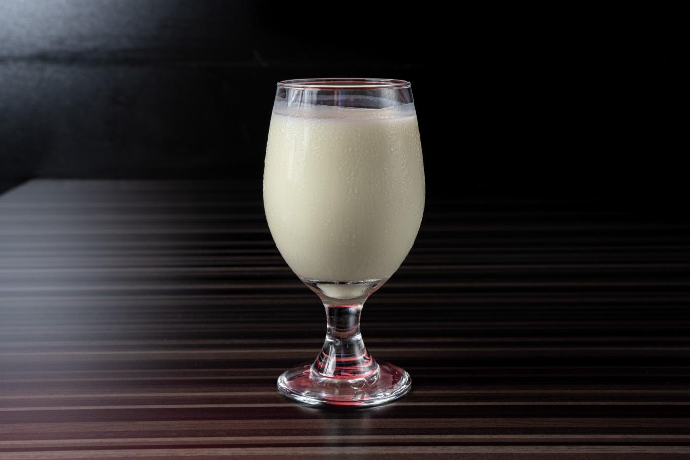 Glass of house-made sweet lassi yogurt drink at India 101