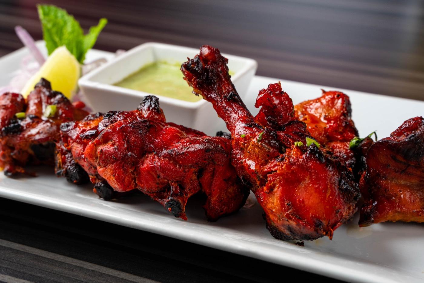 Chargrilled tandoori chicken drumettes with mint chutney at India 101 in Irving, TX